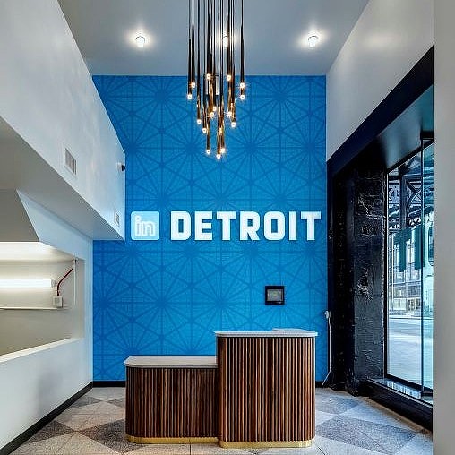 A room with a blue wall and a bench.